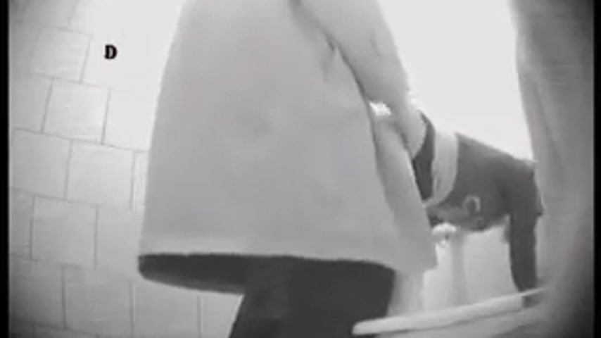 Hidden Camera in University Toilet Captures Stall Handjob